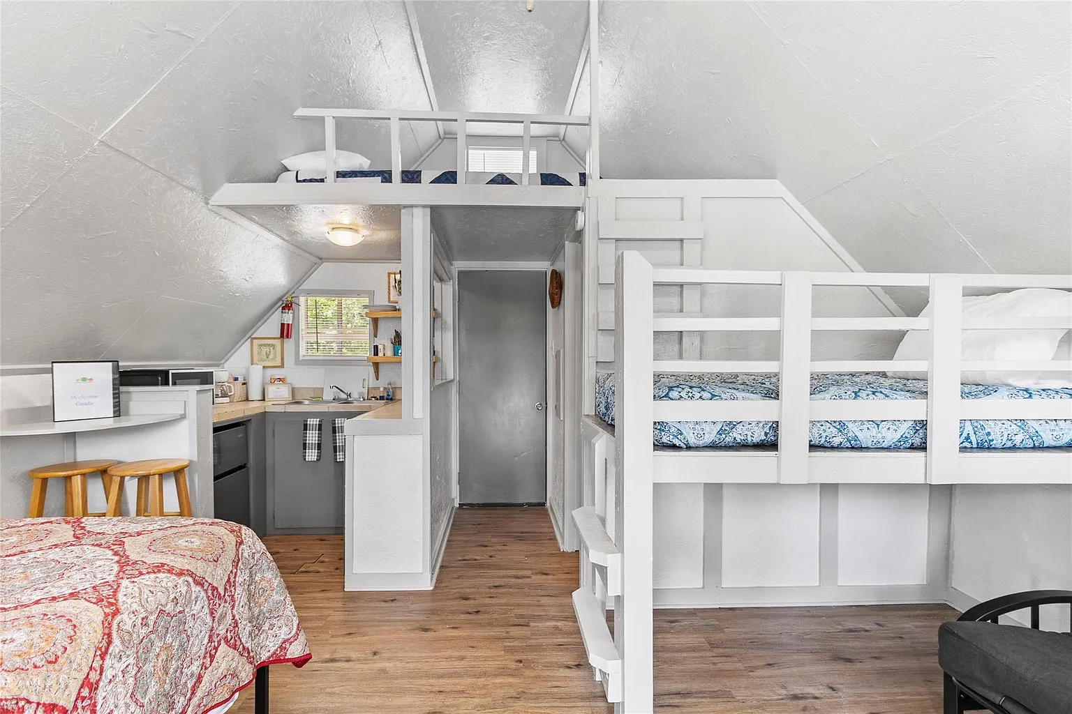 One of our cabins, with bunk beds and a loft sleeping nook